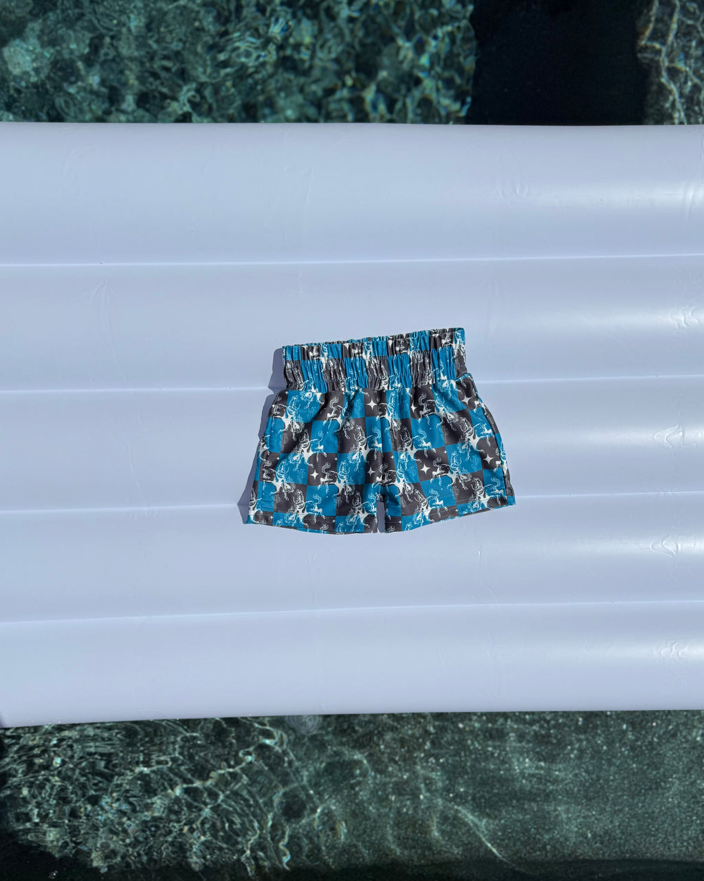 Teal Buckin’ Broncs Swim Trunks (FINAL SALE)