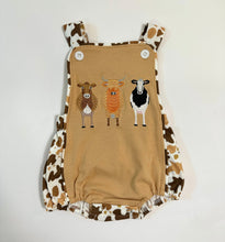 Load image into Gallery viewer, Cow Smocked Suspender Bubble Romper
