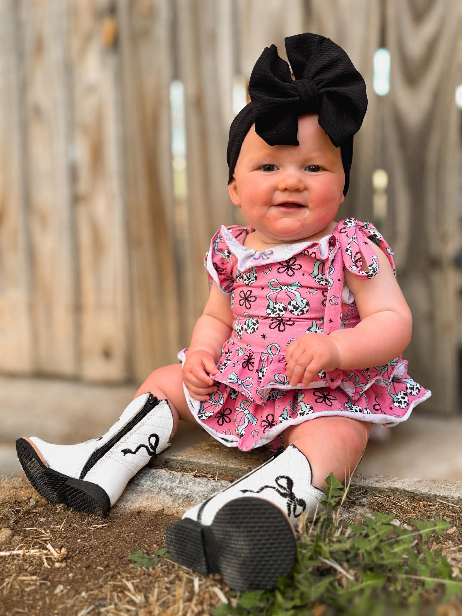 Cow print cherry ruffle romper